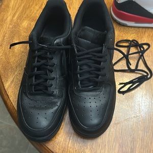Black on black Nike Air Force ones. 8.5